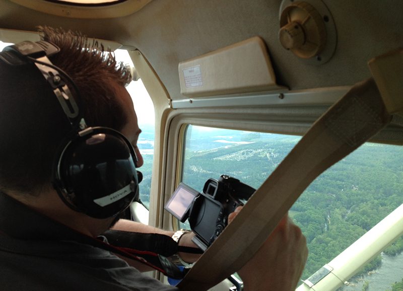 Nick Mastro in Plane shooting aerial photography