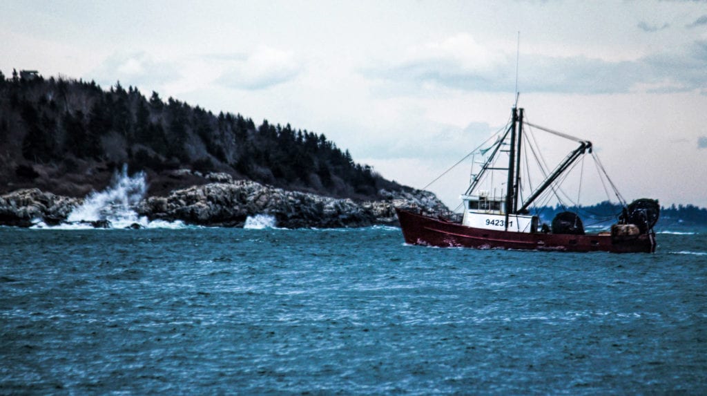 aerial photography of a fishing boat in Maine